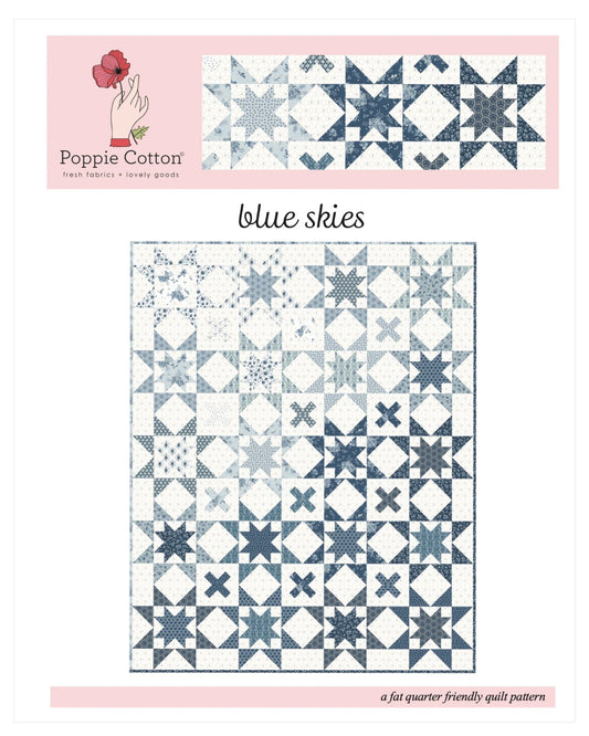 Blue Skies quilt kit by Poppie Cotton featuring Lakeland Blues fabric with blue and white patchwork and floral accents.