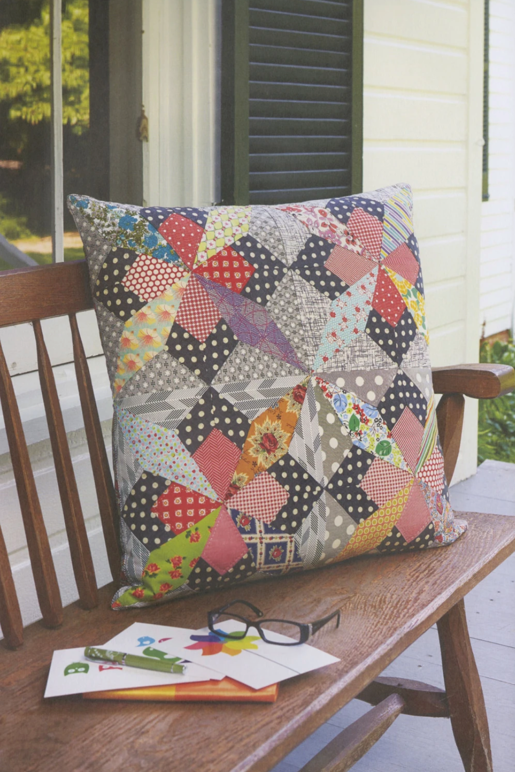 Colorful quilt from Jen Kingwell's Quilt Lovely book featuring vibrant pillow projects, displayed on a cozy bed.