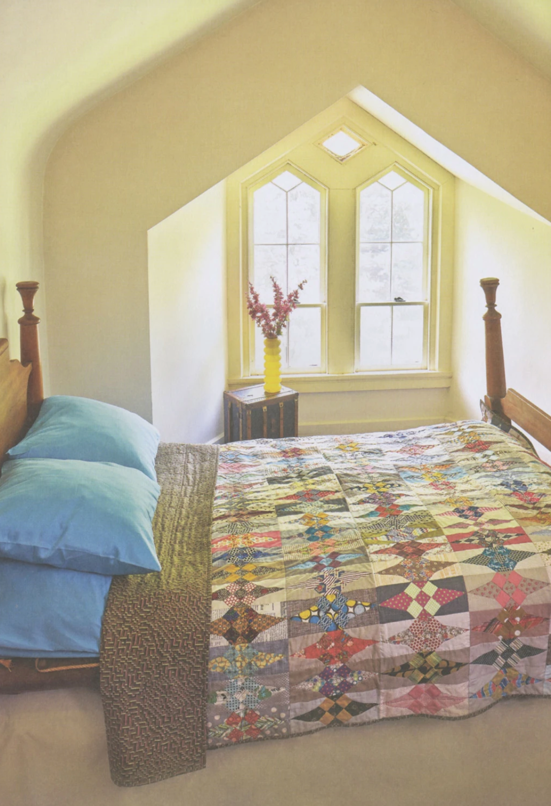 Colorful quilt made from Jen Kingwell's "Lovely Book" featuring 15 vibrant projects, shown in a Krause Publications quilt book.