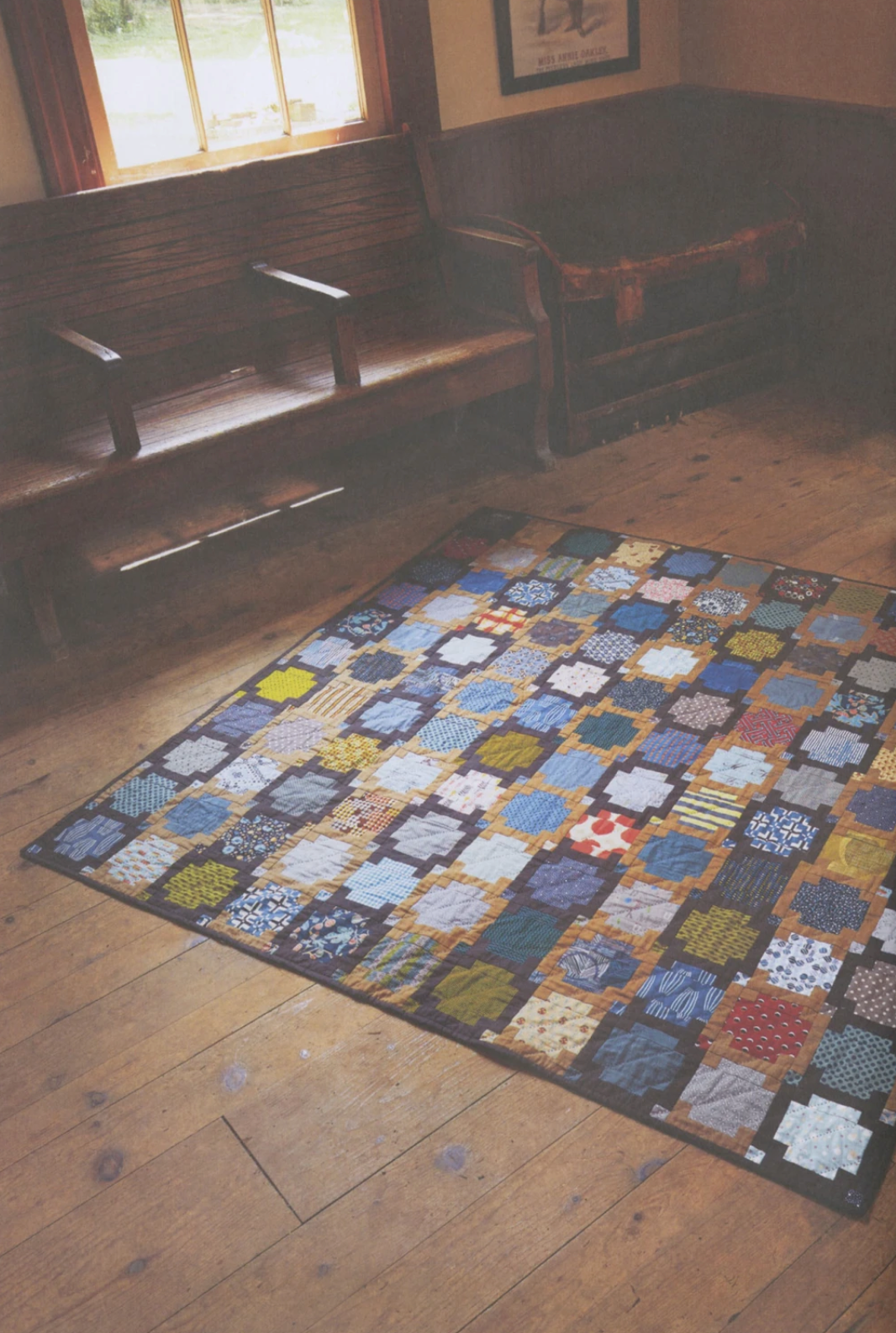 Vibrant quilt project from "Quilt Lovely" book by Jen Kingwell, featuring colorful patchwork designs on a quilt book cover.