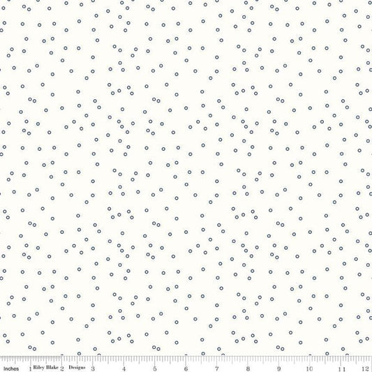 Blue quilting cotton fabric with tiny circle bee background pattern by Riley Blake Designs, suitable for quilting and crafting projects.