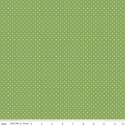 Green Swiss Dot quilting cotton fabric by Riley Blake Designs, featuring small white dot pattern on soft green material.