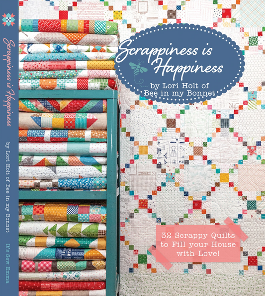Scrappiness Is Happiness quilt book cover by Lori Holt showing colorful quilt patterns and vibrant design elements.
